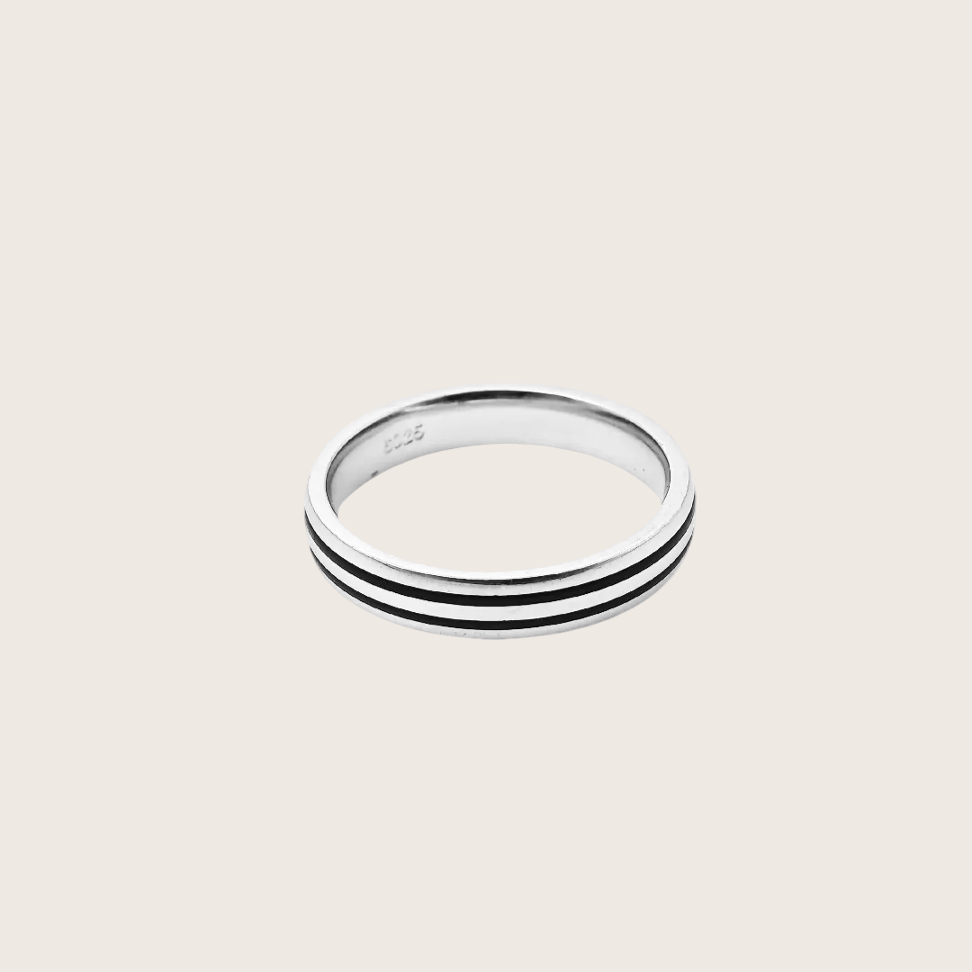 Silver ring with two horizontal stripes on a white background
