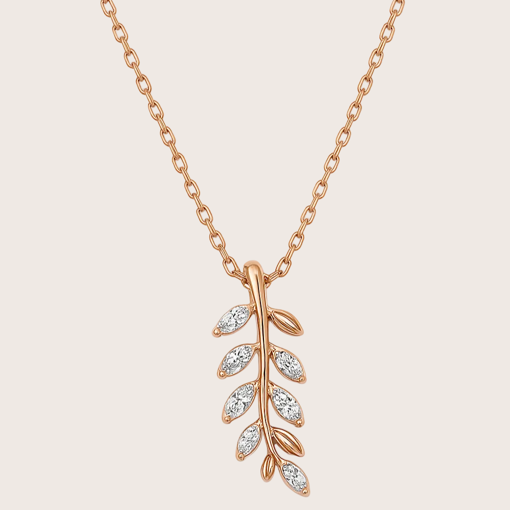 Rose gold necklace with a leaf-shaped pendant on a white background