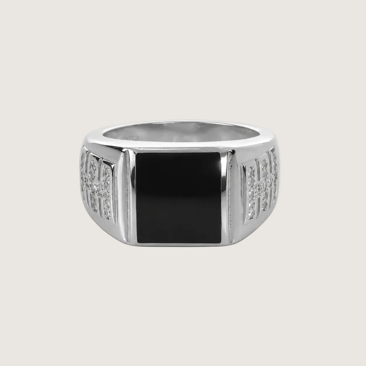 Silver ring with a black center on a light gray background