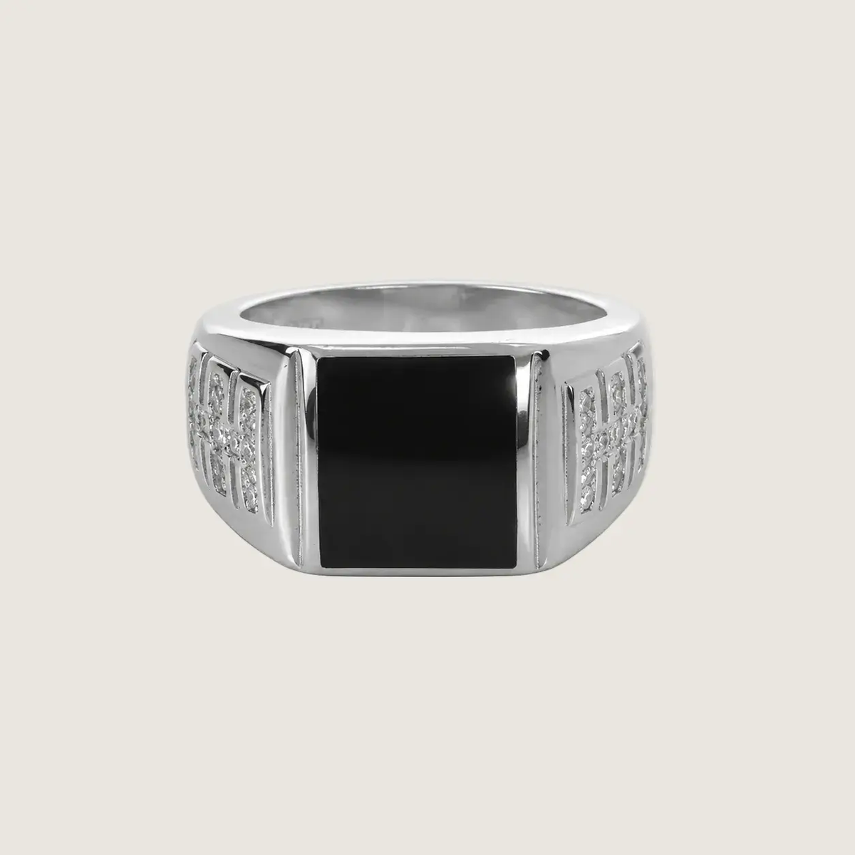 Silver ring with a black center on a light gray background