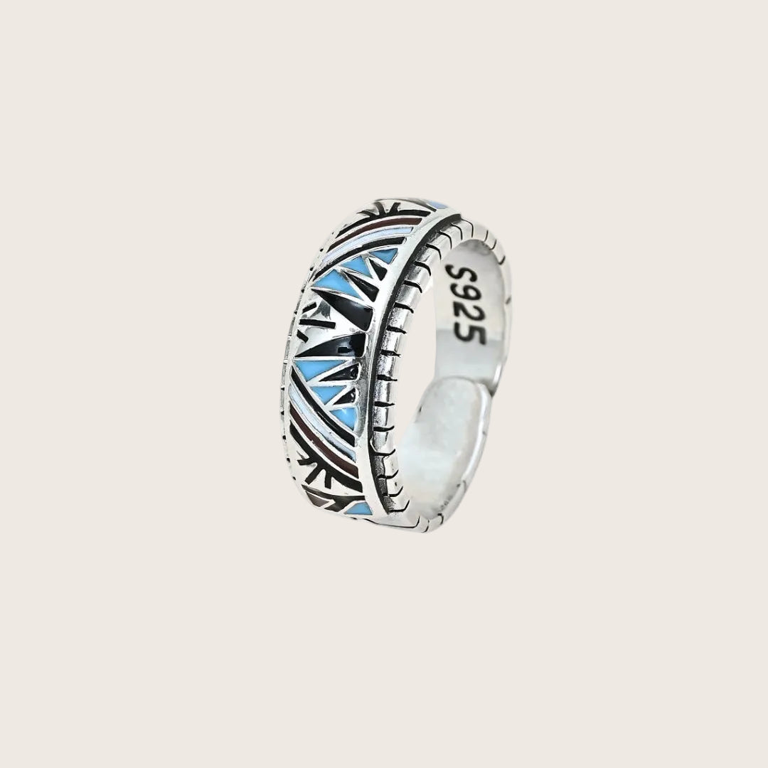 Silver ring with blue accents and 'S925' marking on a white background, branded 'TRISHNHA'.