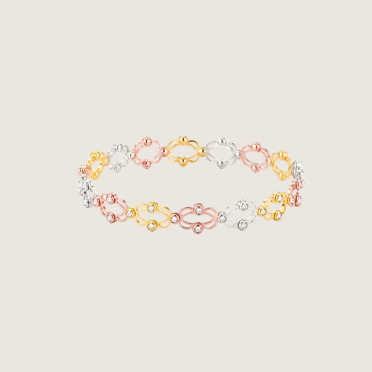 Three-colored bracelet on a light gray background