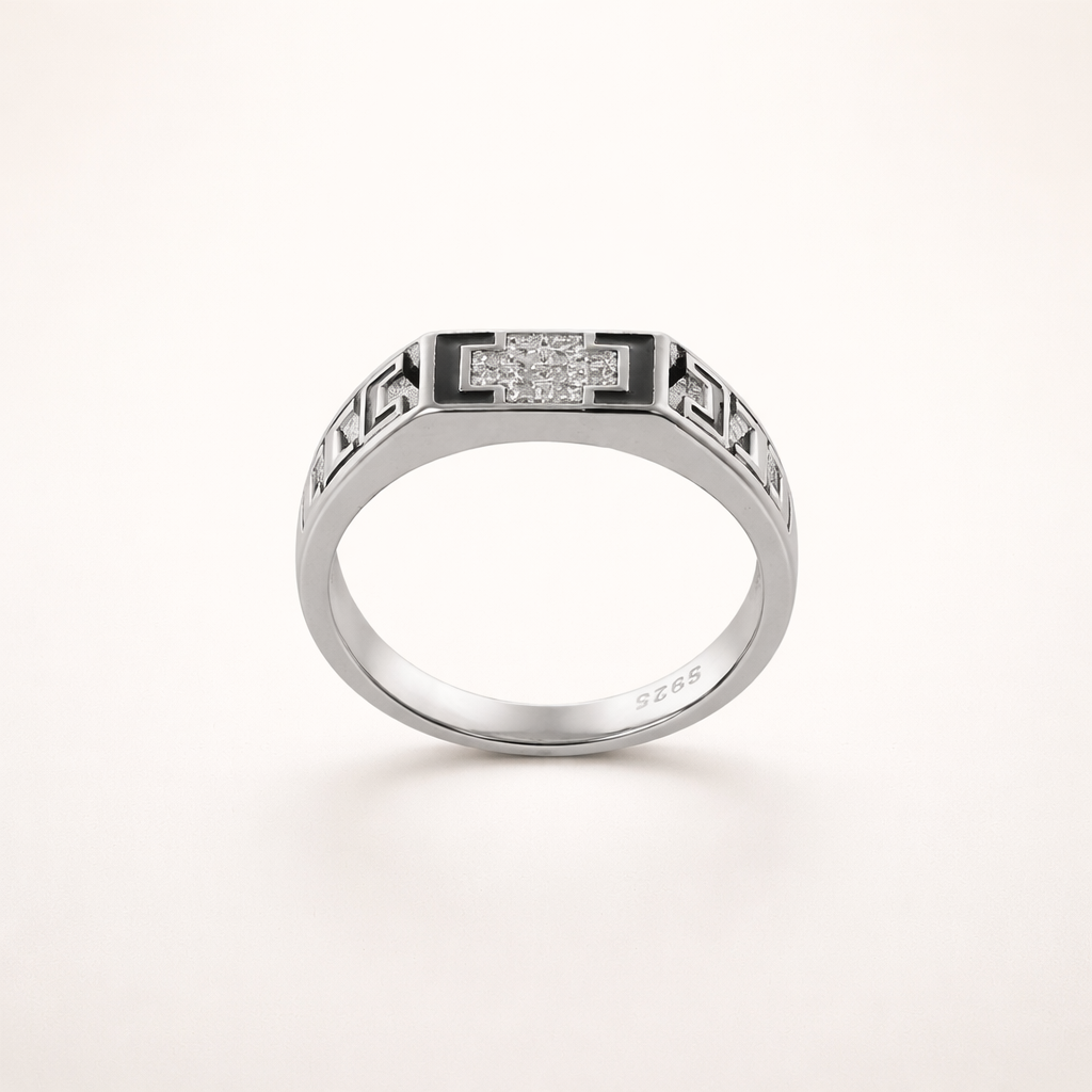 Silver ring with diamond accents on a white background