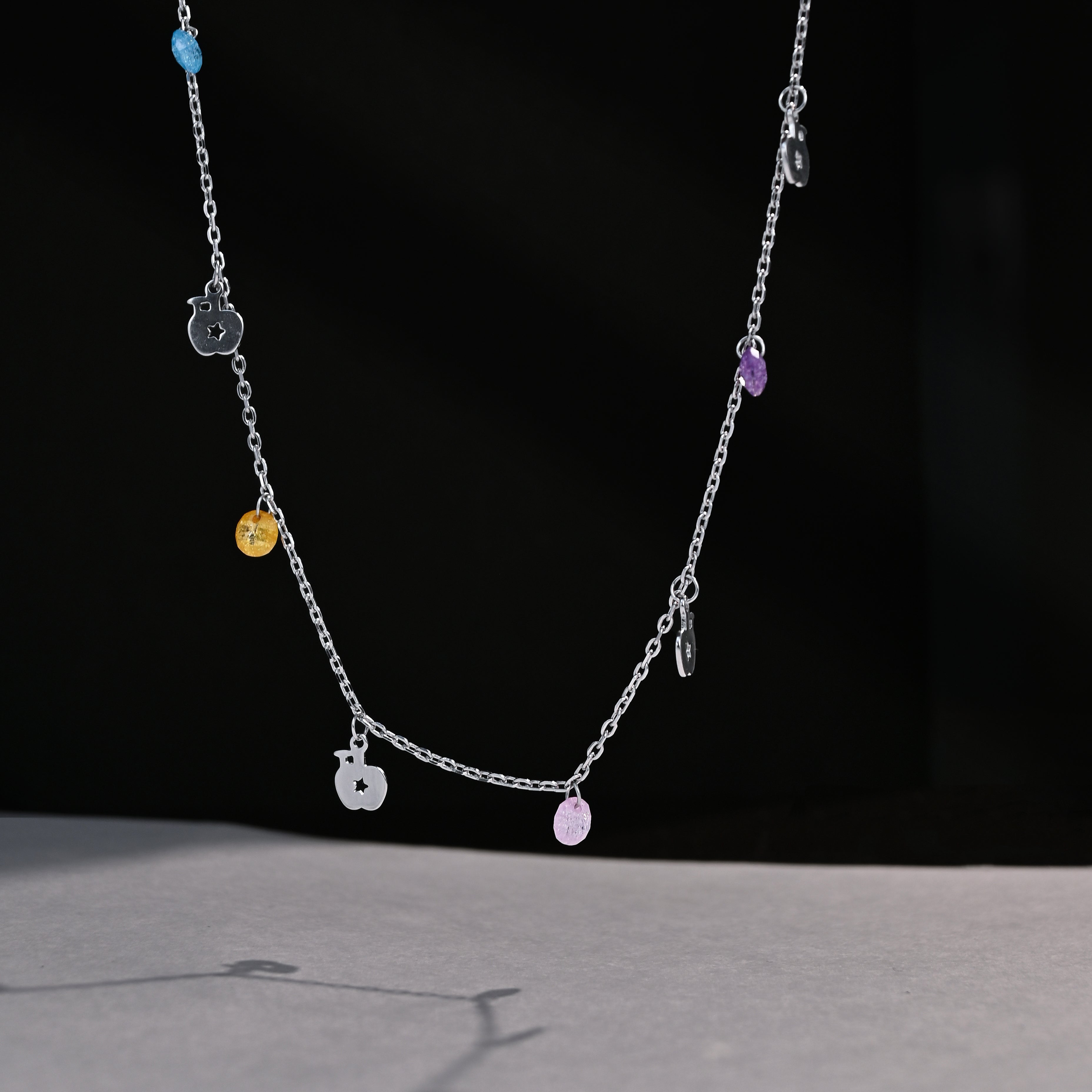 Necklace with colorful beads on a black background