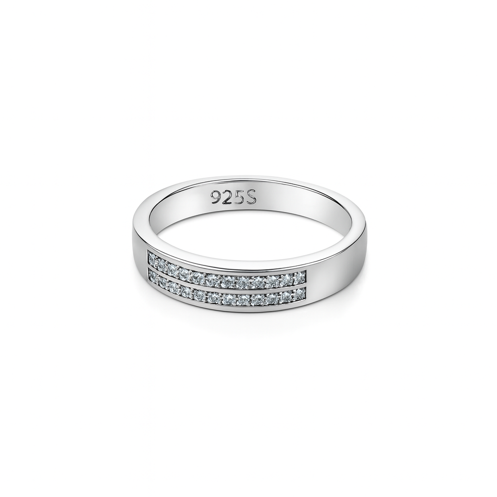 Silver ring with embedded stones on a white background