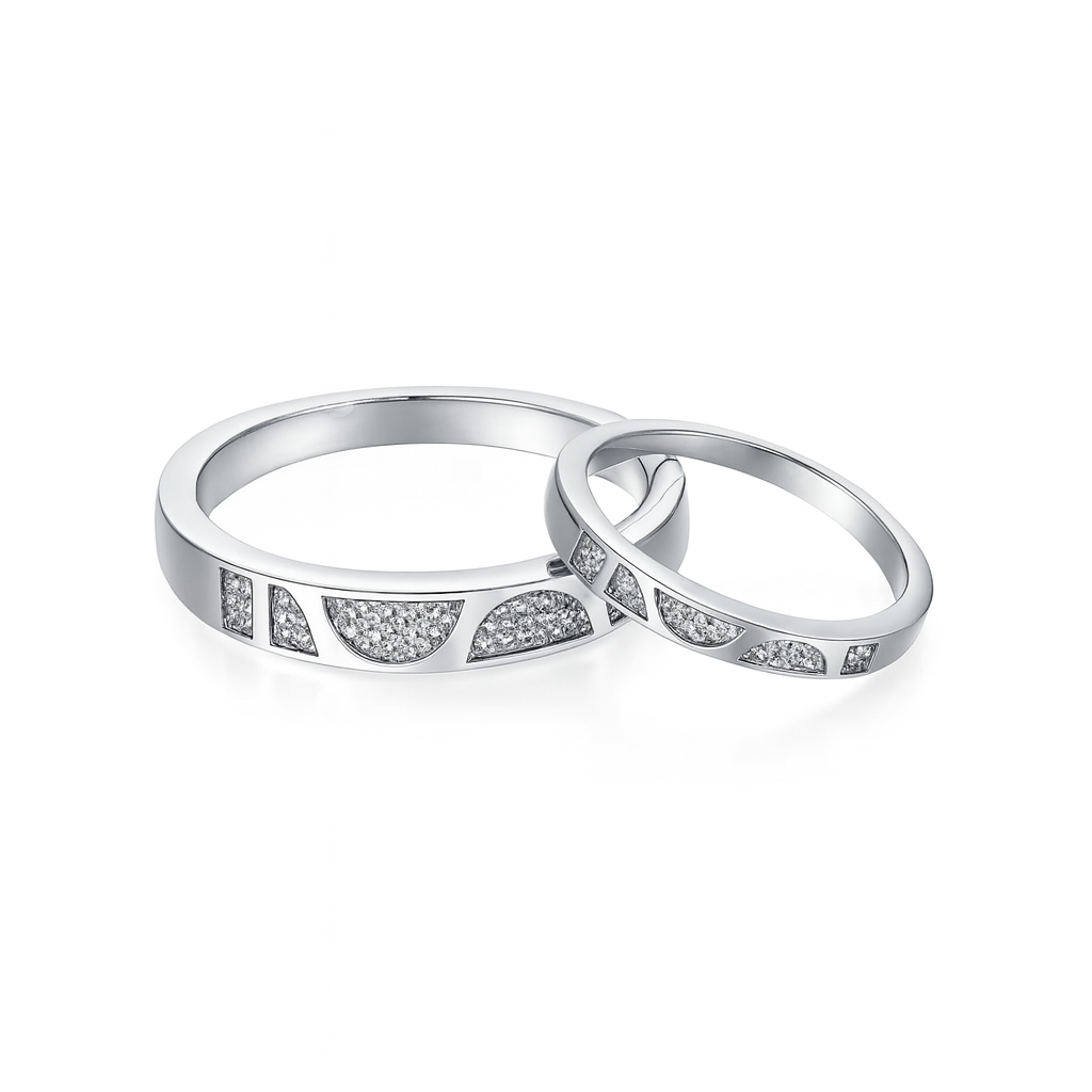 Two silver rings with small diamonds on a white background