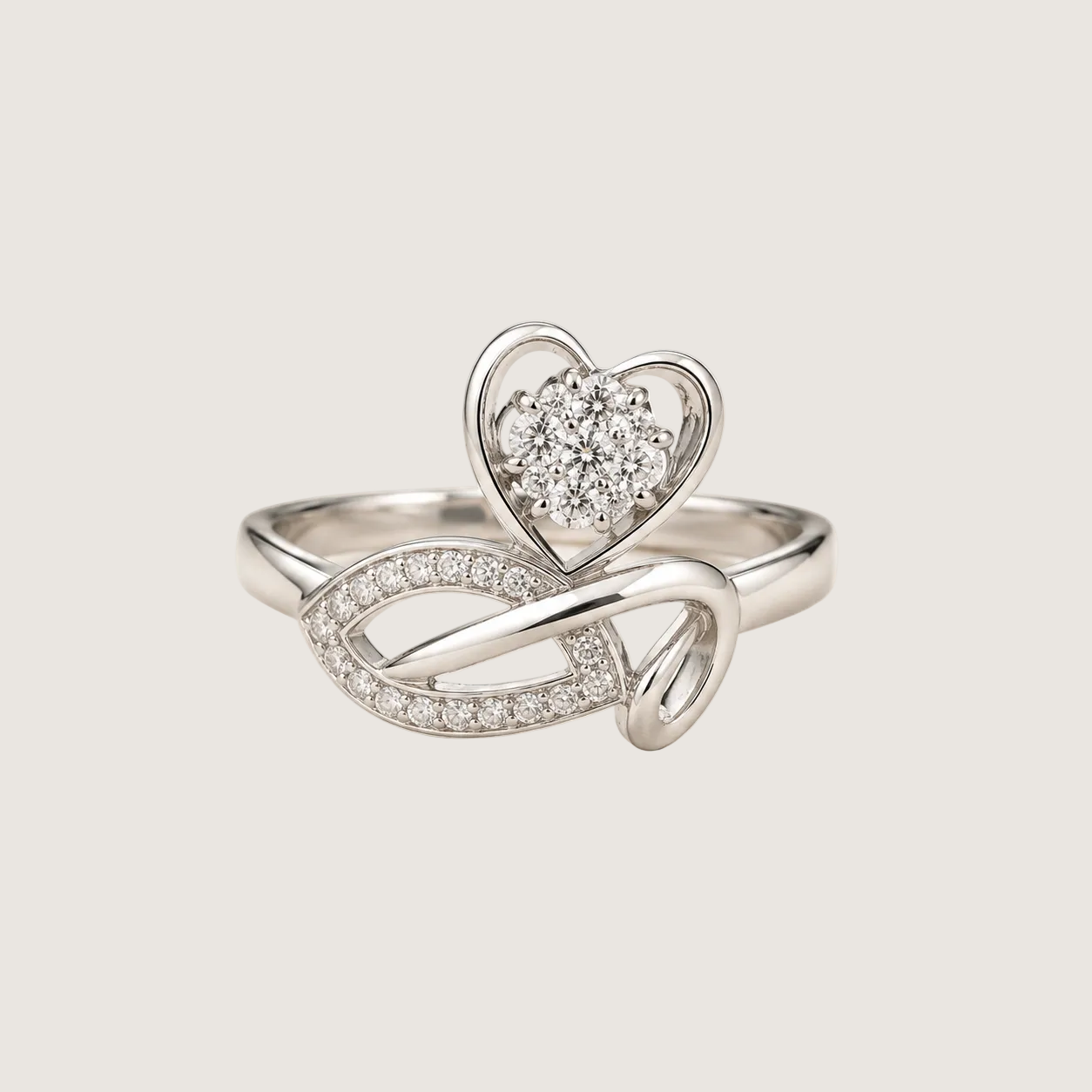 Silver ring with heart design on a light beige background