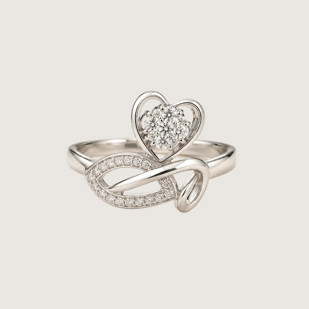 Silver ring with heart design on a light beige background
