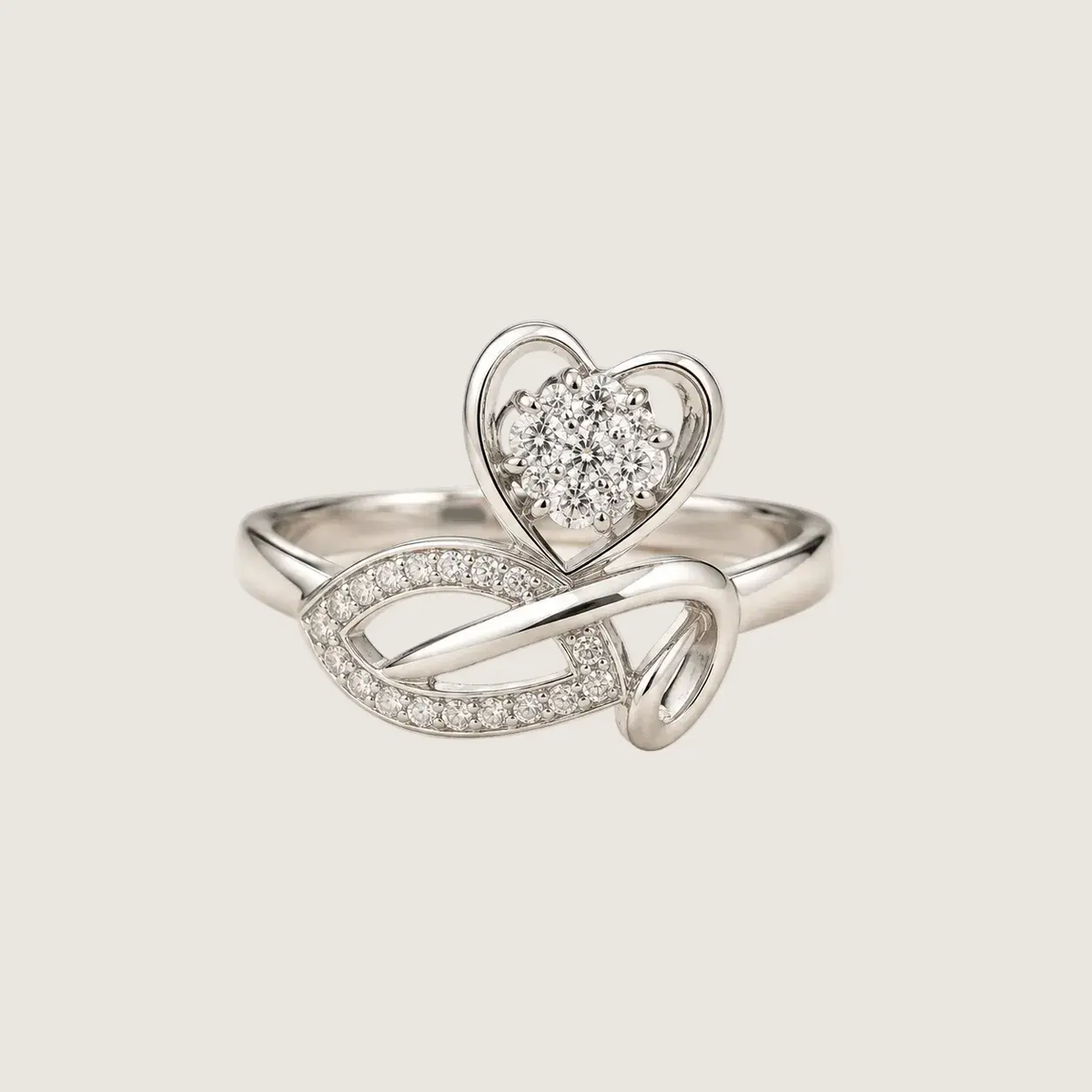 Silver ring with heart design on a light beige background