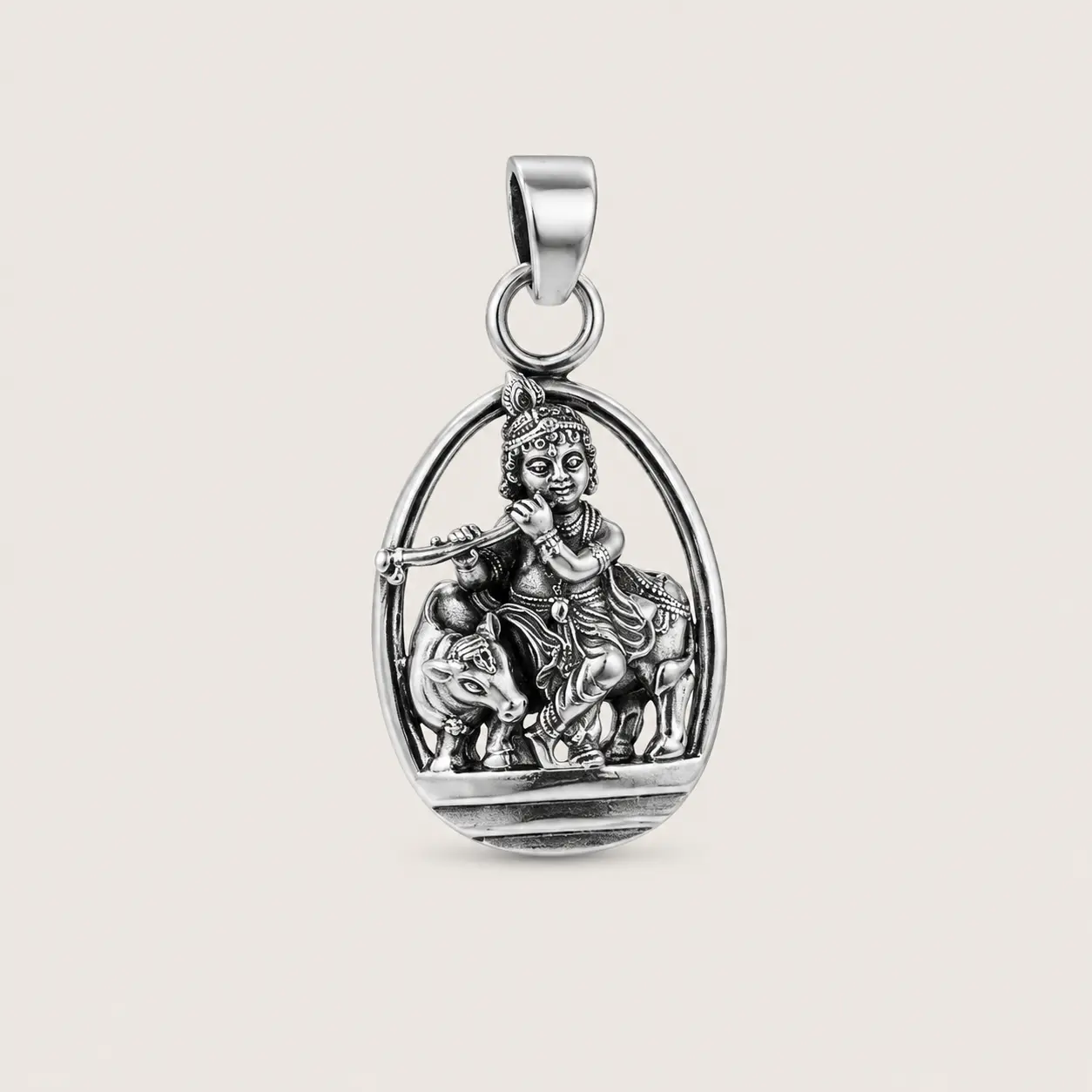 Silver pendant with a religious figure on a beige background