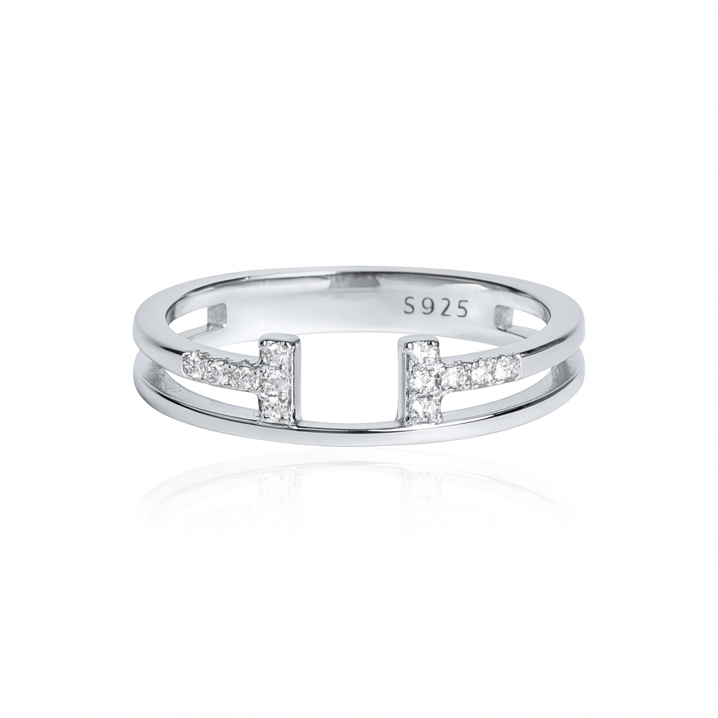 Silver ring with small diamonds on a white background