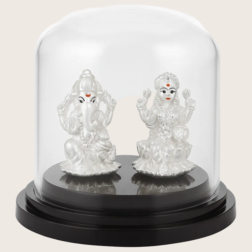 Two silver神像figures under a glass dome on a white background