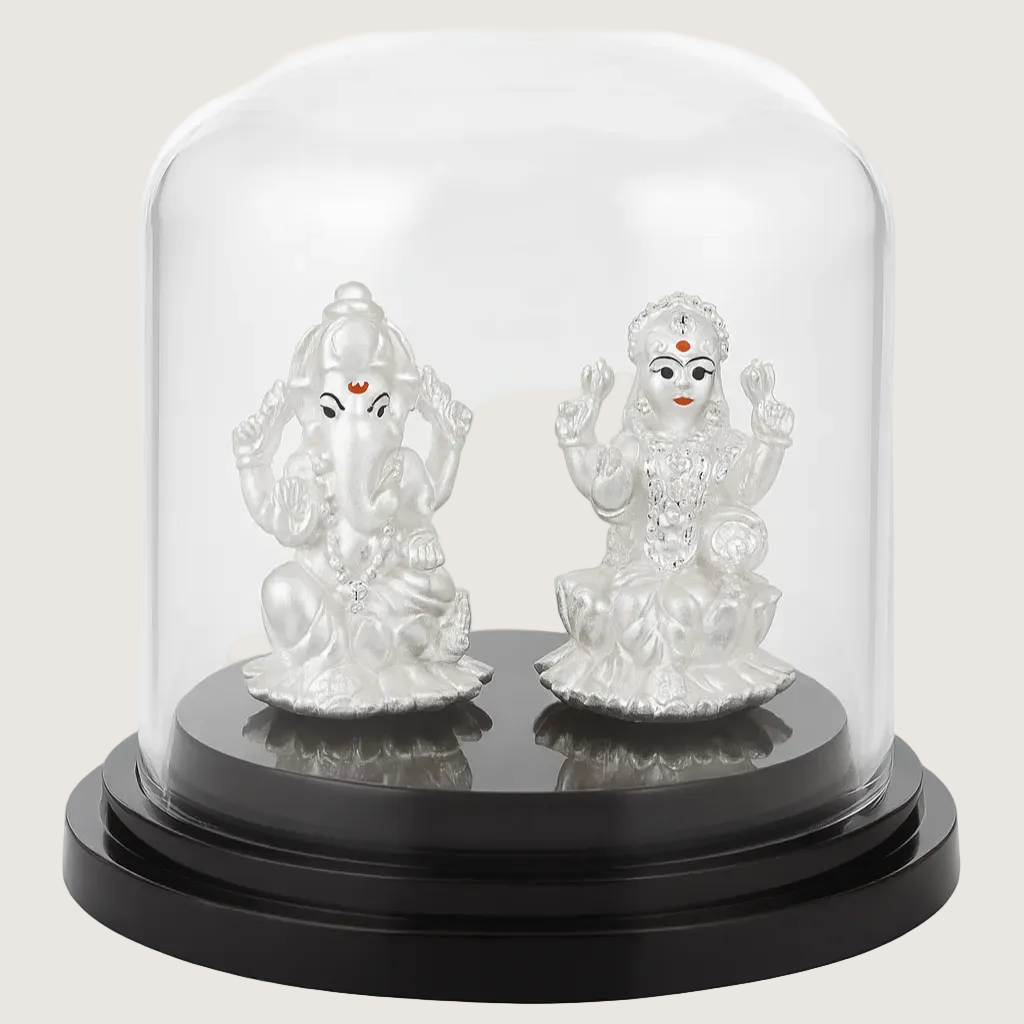 Two silver神像figures under a glass dome on a white background
