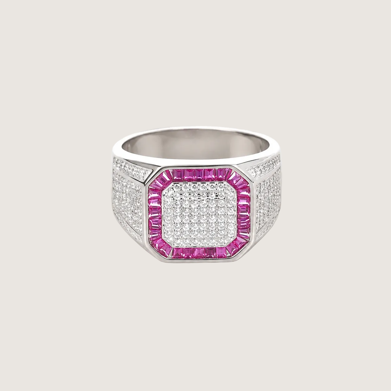 Silver ring with pink gemstone and diamond accents on a light gray background