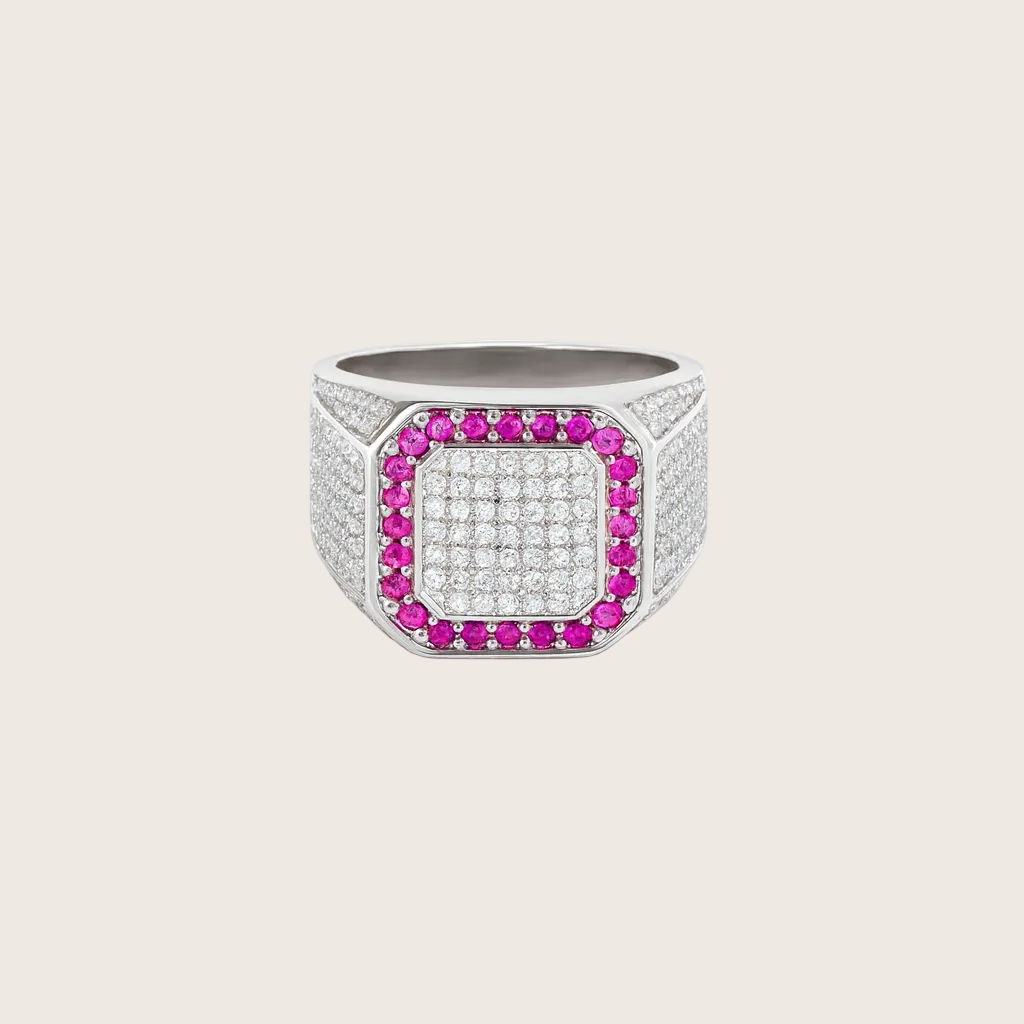 Silver ring with pink gemstones on a white background
