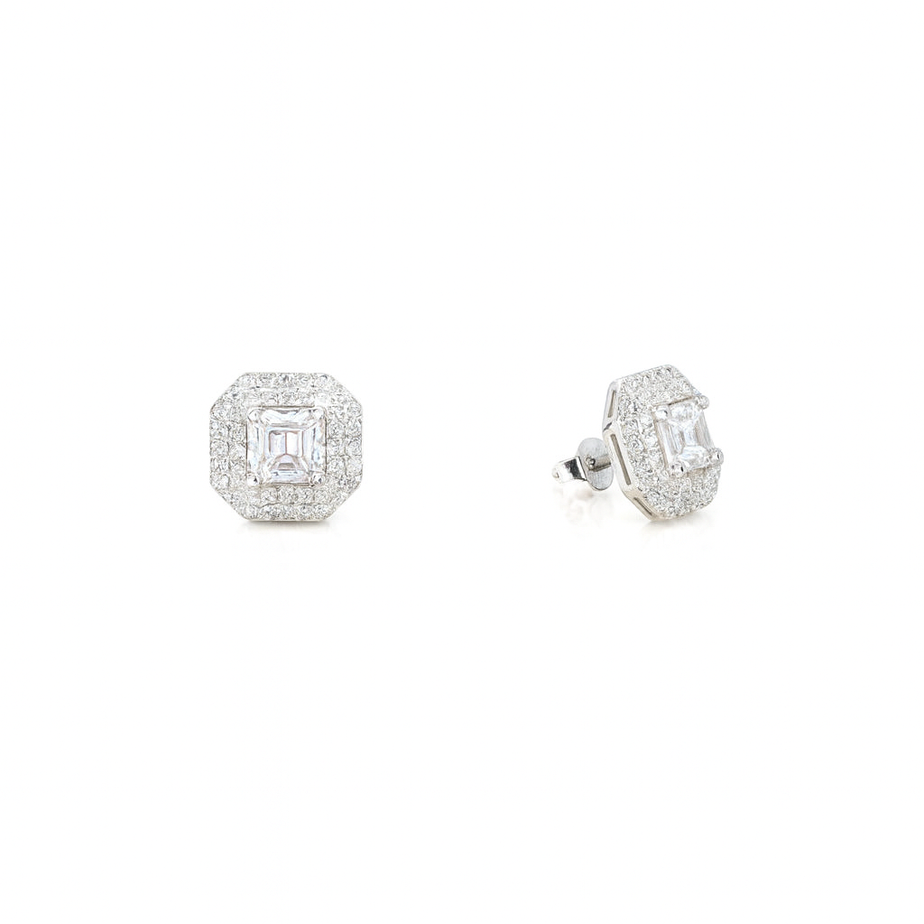 Pair of diamond earrings on a white background