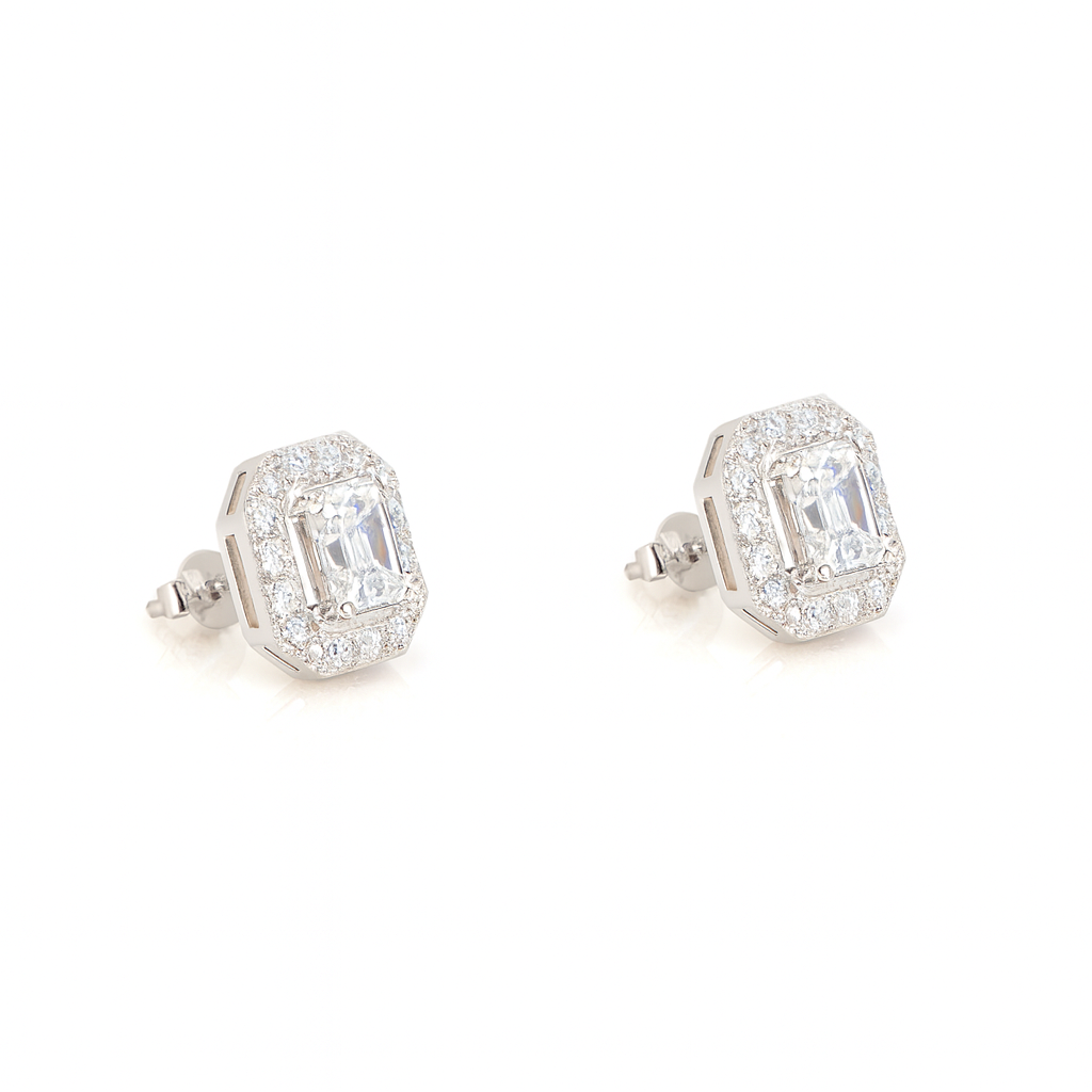 Pair of diamond earrings on a white background