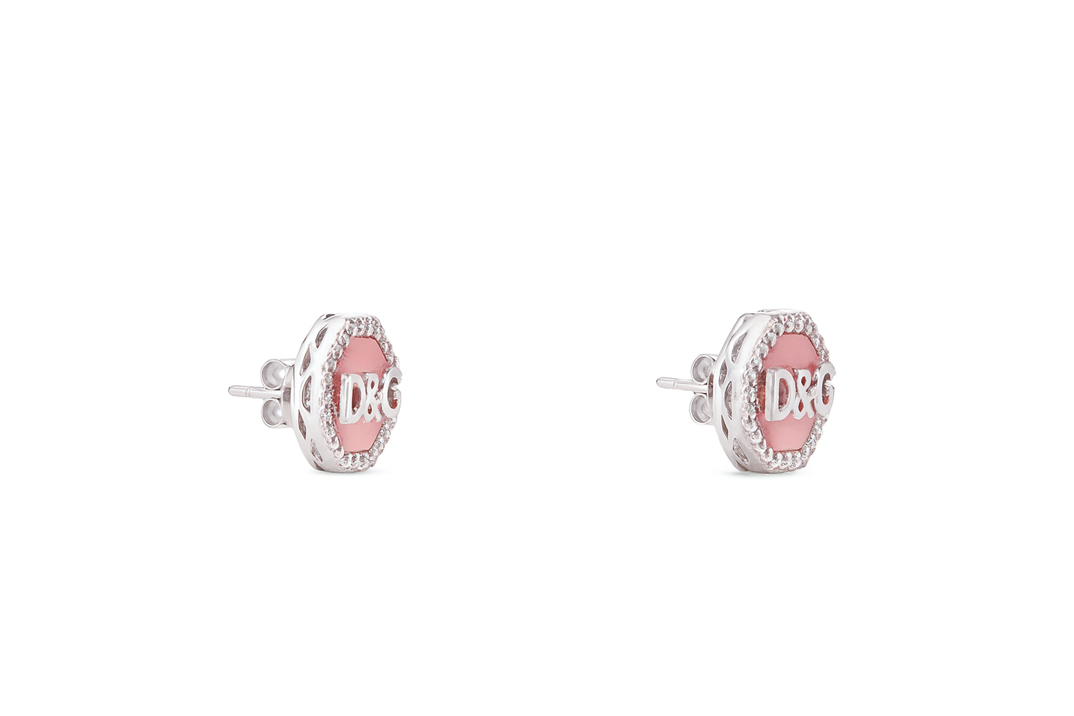 Pair of earrings with pink centers and silver outer parts on a white background