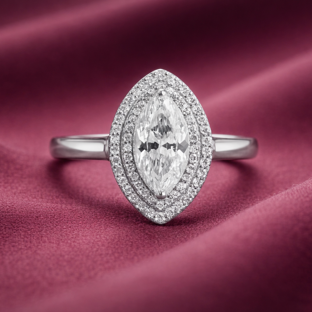 Diamond ring on a burgundy fabric background