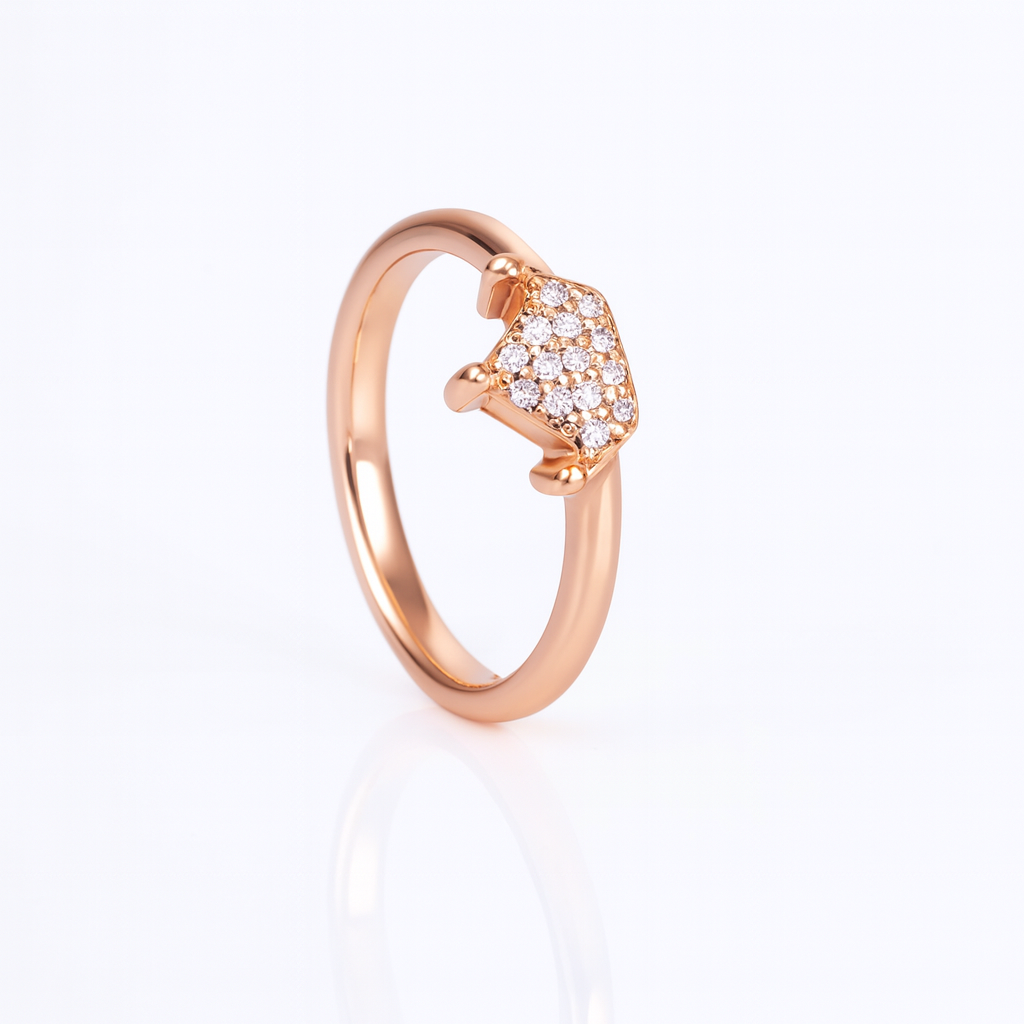 Rose gold ring with diamond accents on a white background