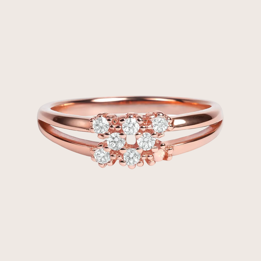 Rose gold ring with diamonds on a white background