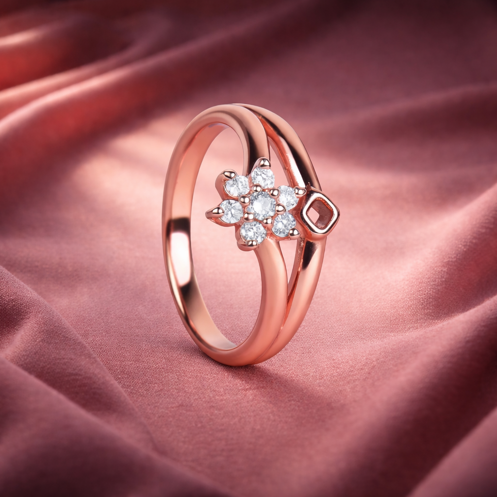 Rose gold ring with diamond flower design on pink fabric