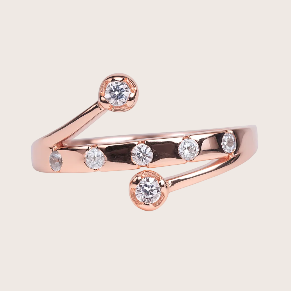 Rose gold ring with diamond accents on a white background