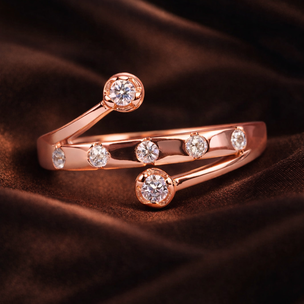 Rose gold ring with diamonds on a brown fabric background