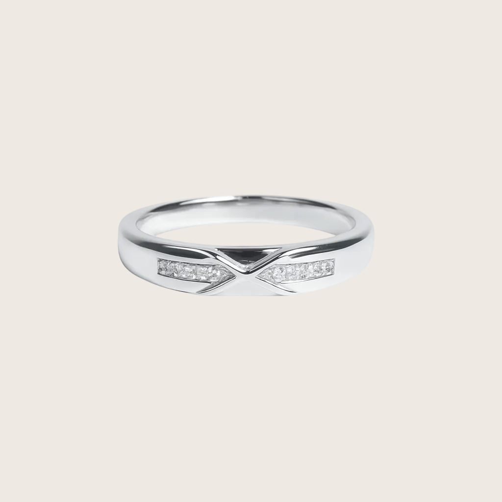 Silver ring with small diamonds on a white background