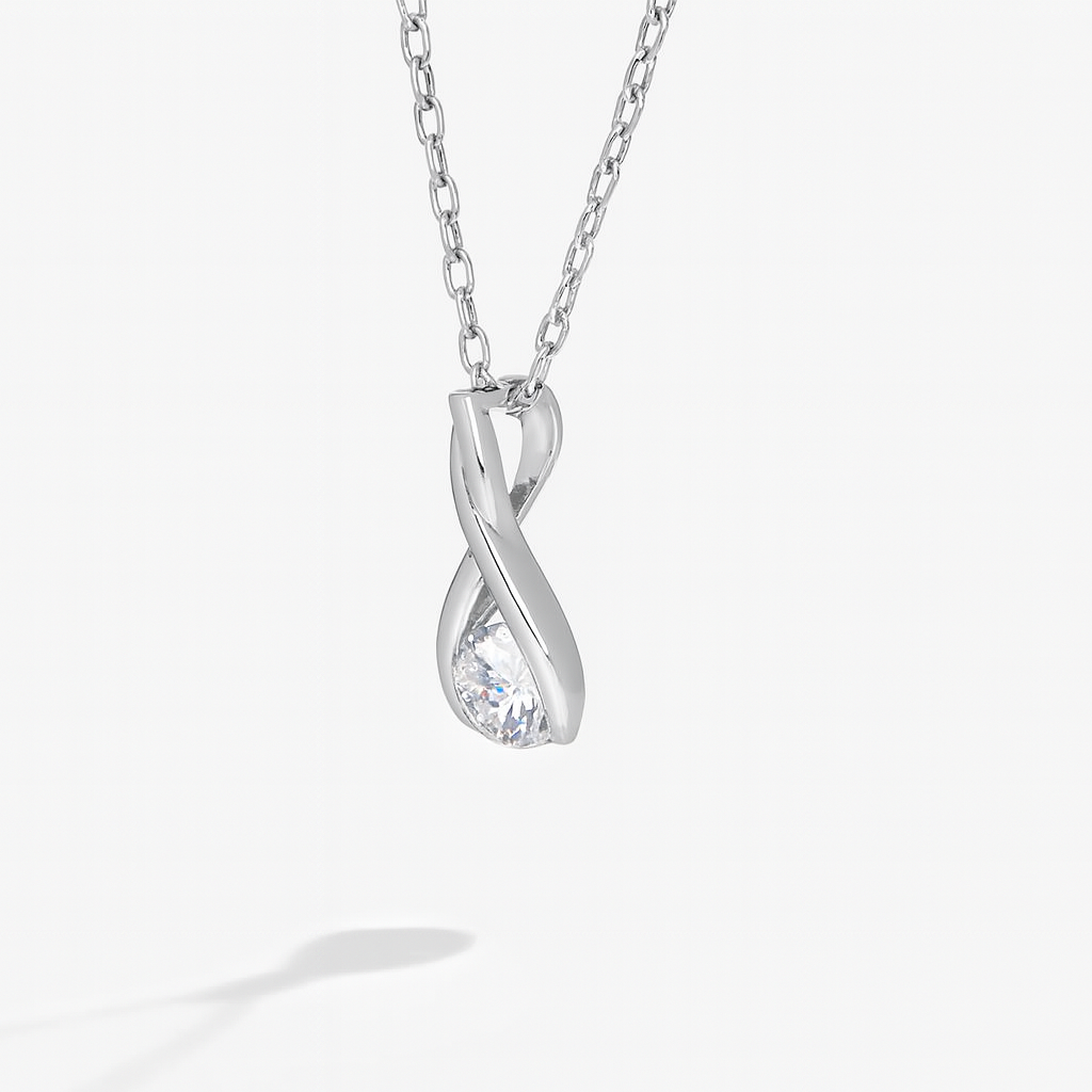 Silver infinity-shaped pendant necklace on a white background