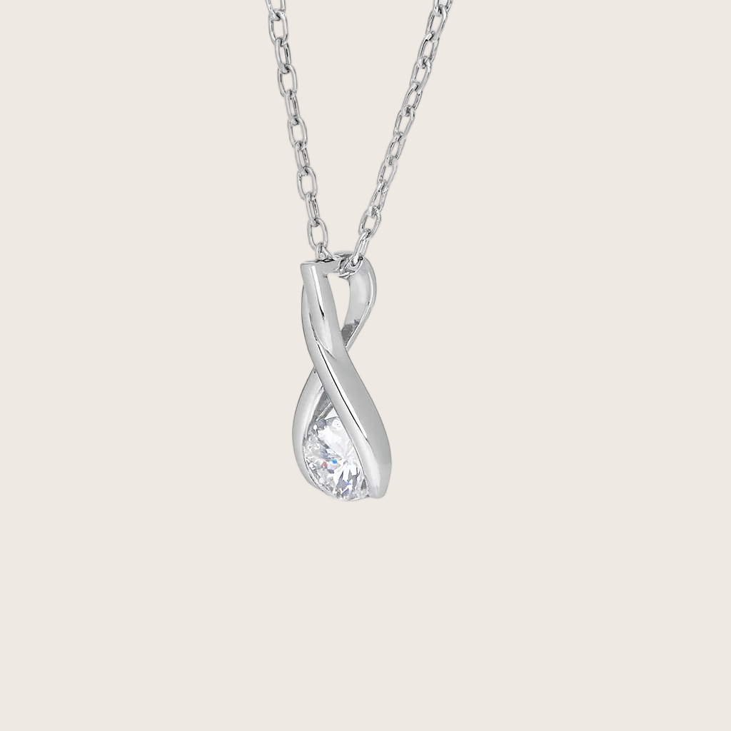 Silver infinity-shaped pendant necklace on a white background