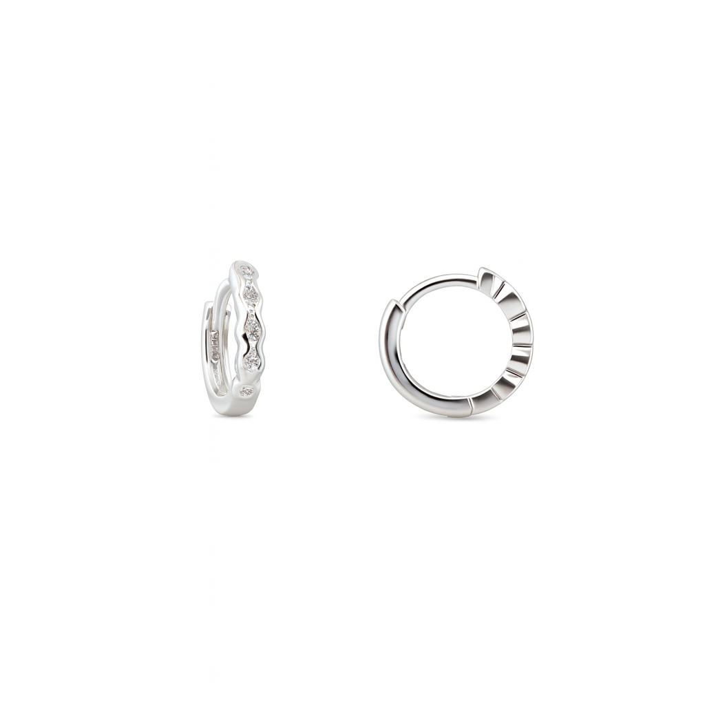 Pair of silver hoop earrings on a white background