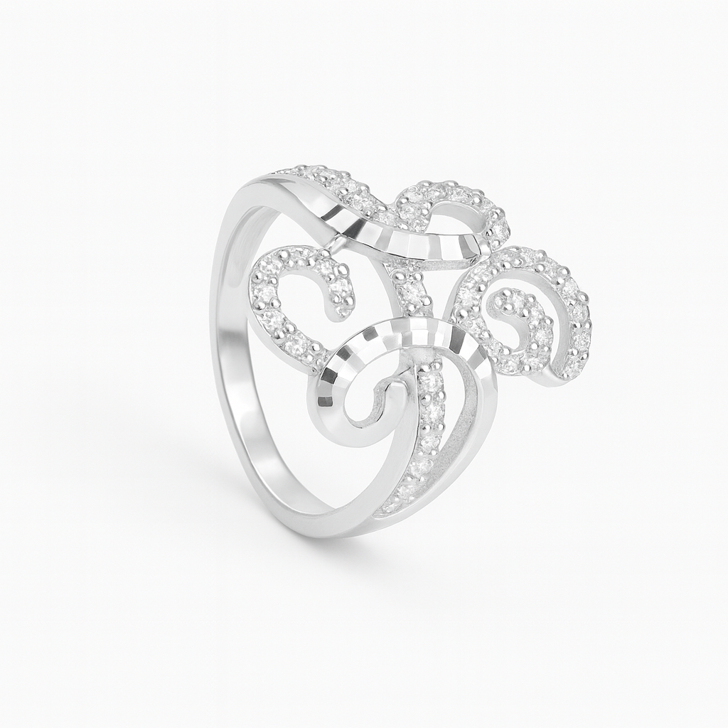 Silver ring with intricate design on a white background
