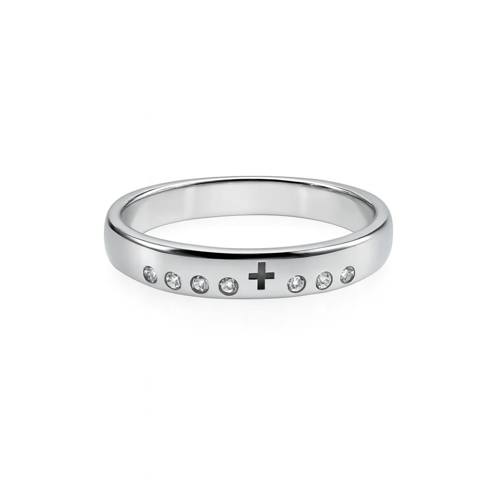 Silver ring with small stones and a cross symbol on a white background