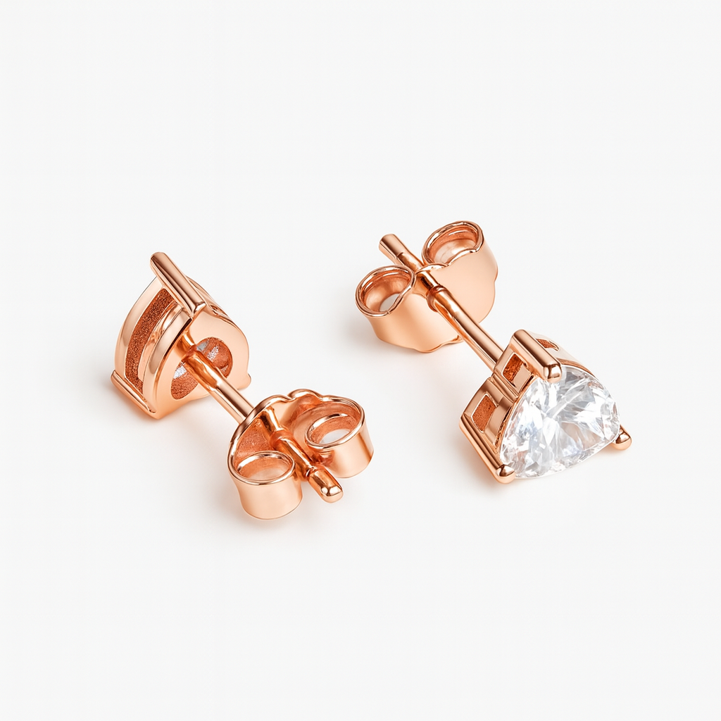 Rose gold stud earrings with a clear gemstone on a white background