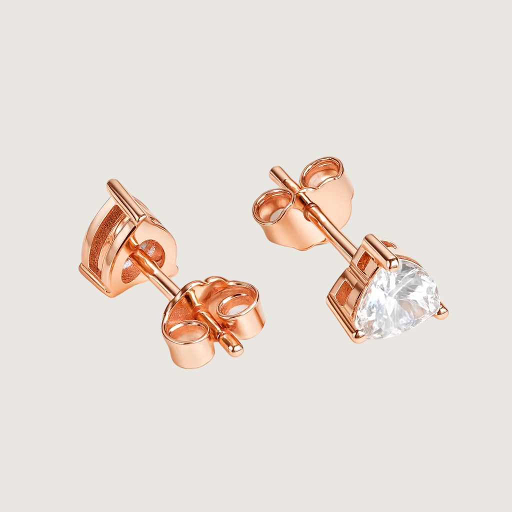 Rose gold stud earrings with a clear gemstone on a white background