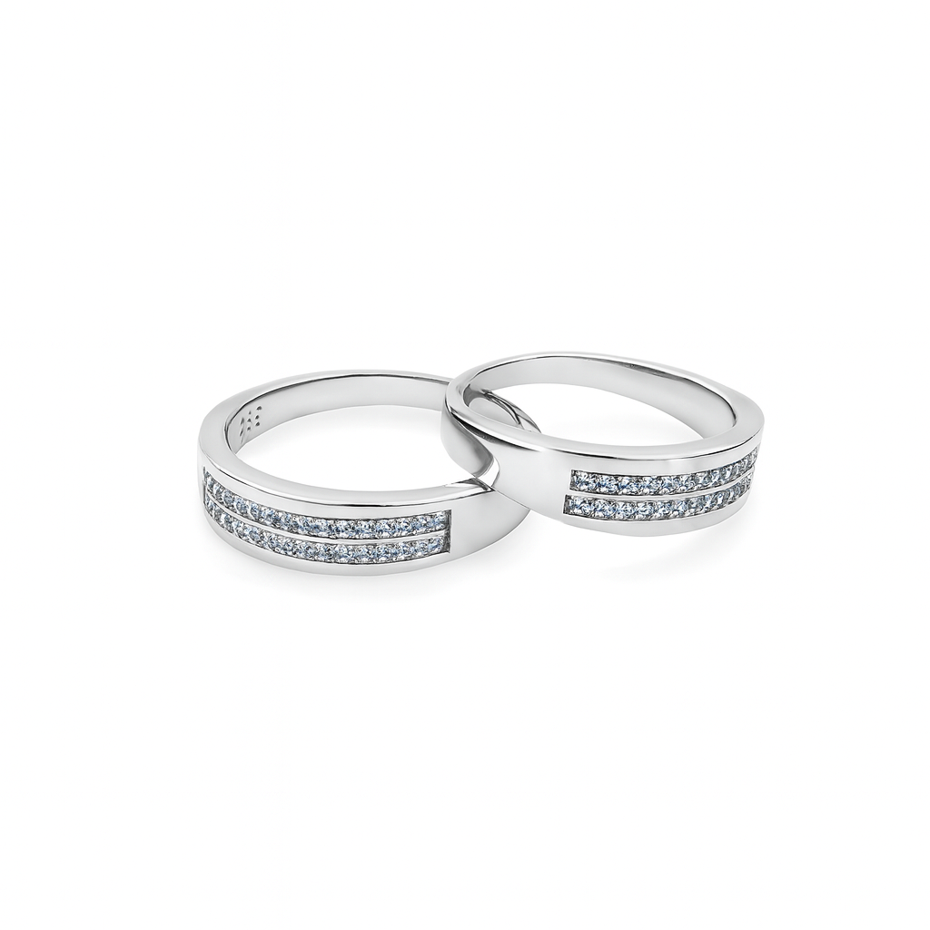 Two silver rings with diamond accents on a white background
