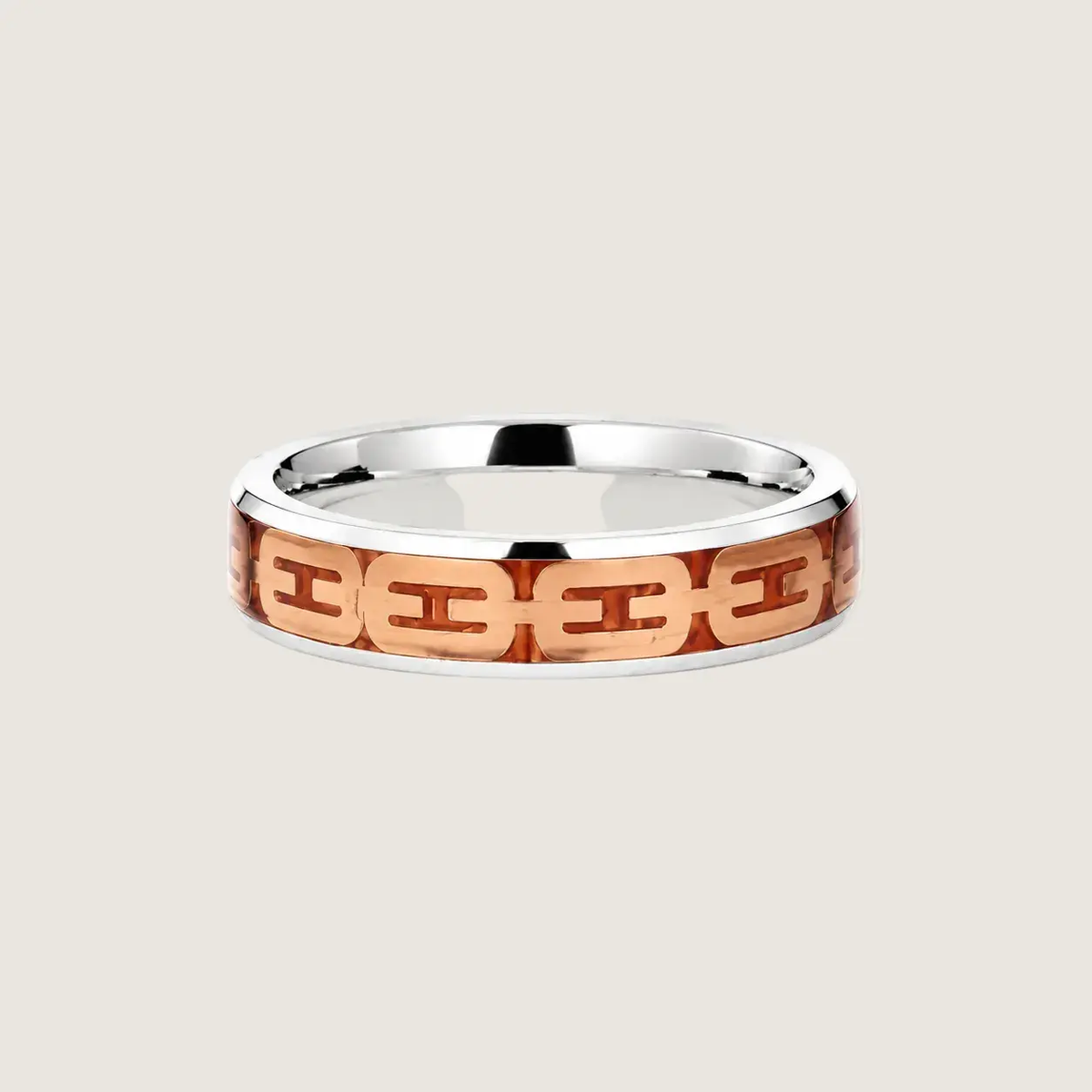 Silver ring with a rose gold chain design on a beige background
