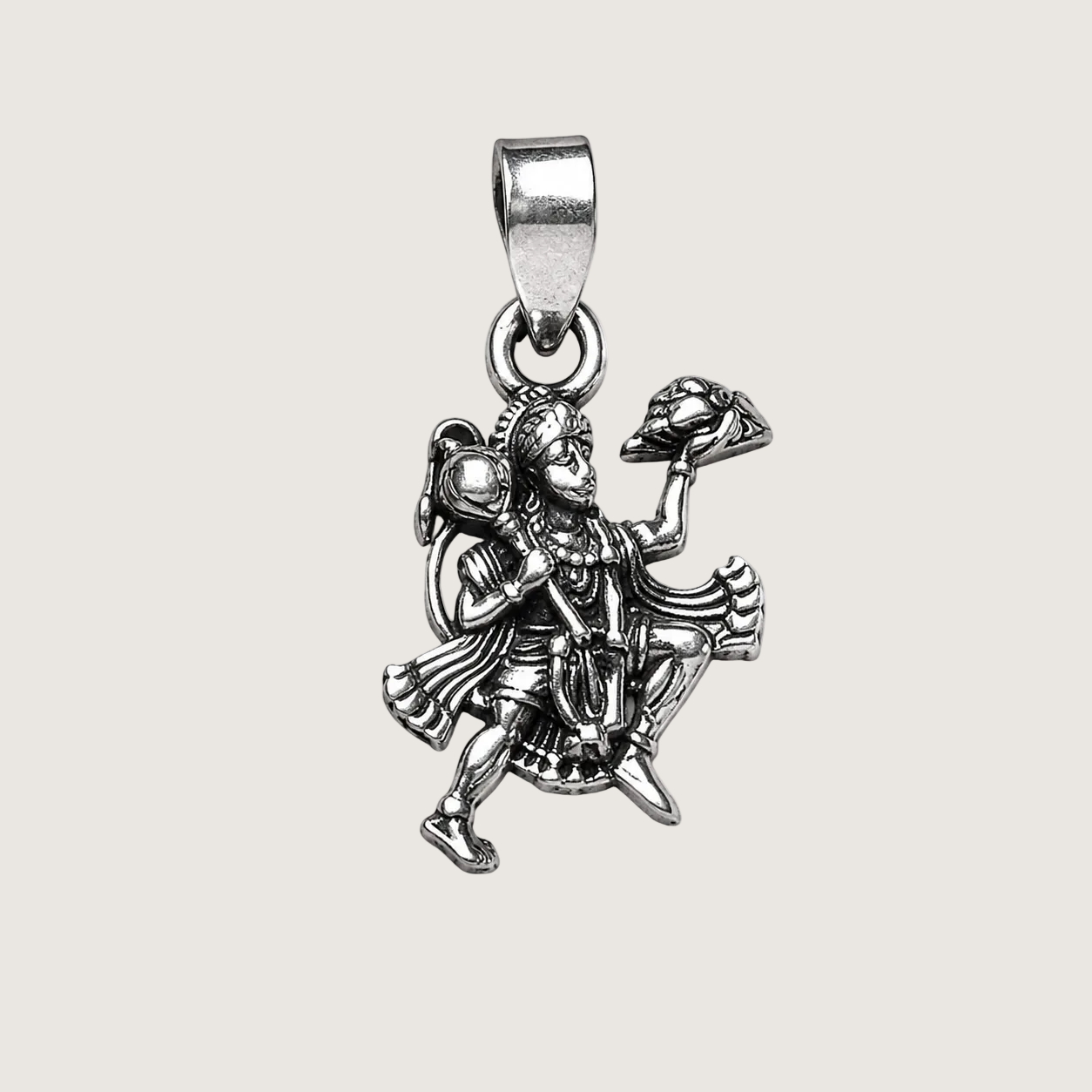 Silver pendant with an angel design on a white background
