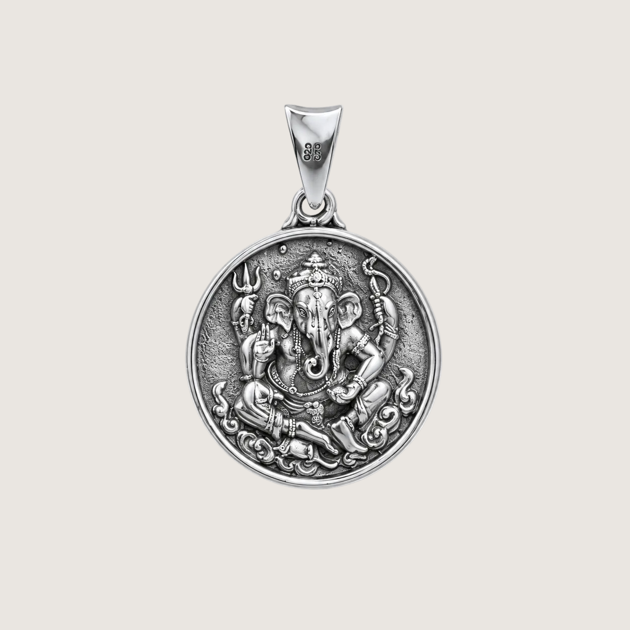 Silver pendant with Ganesha design on a light gray background
