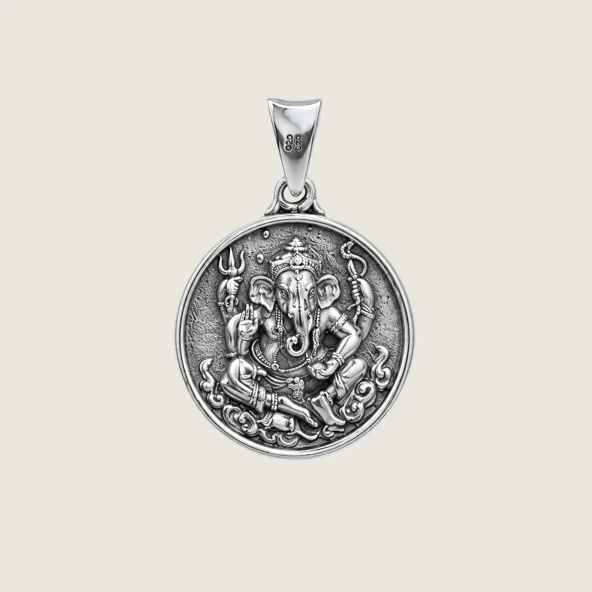 Silver pendant with Ganesha design on a light gray background