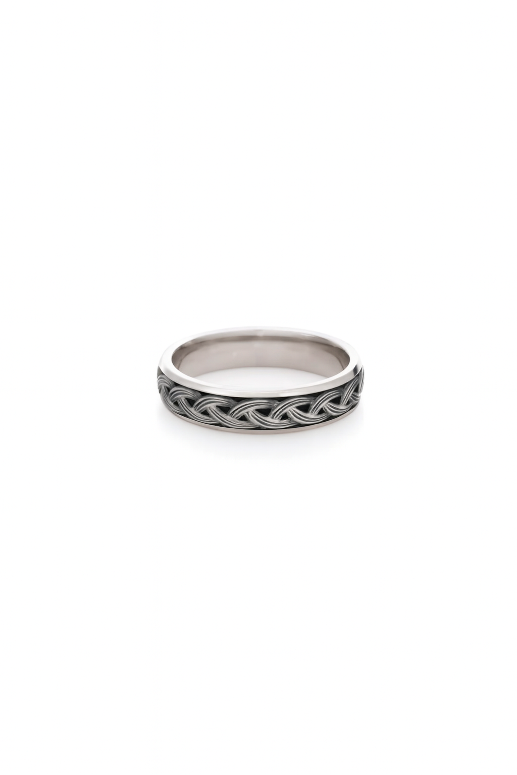 Silver ring with intricate design on a white background