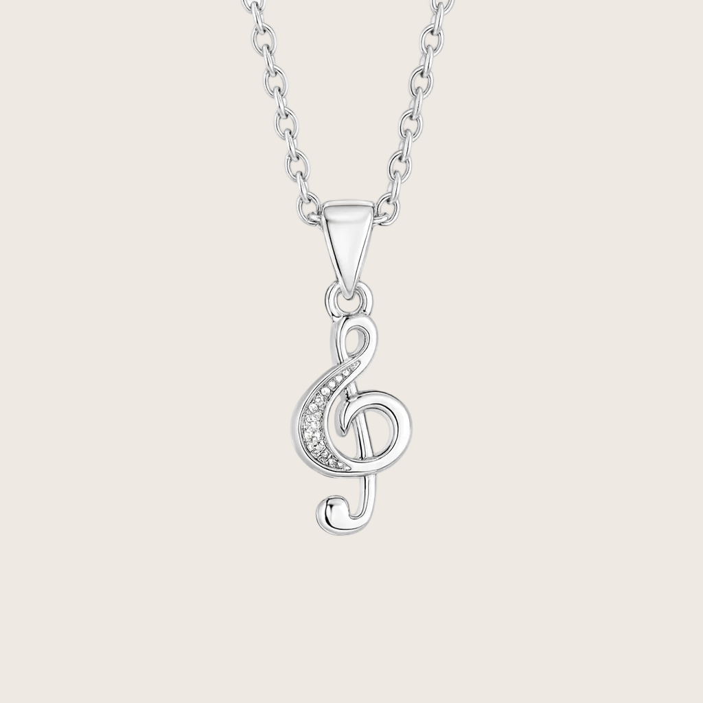 Silver necklace with a treble clef pendant on a white background