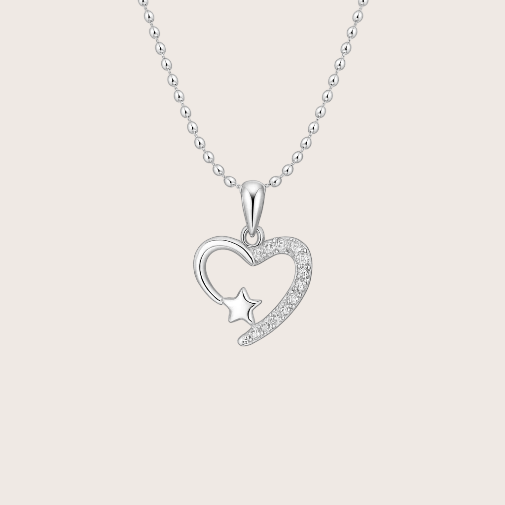 Silver heart-shaped pendant with a star on a white background