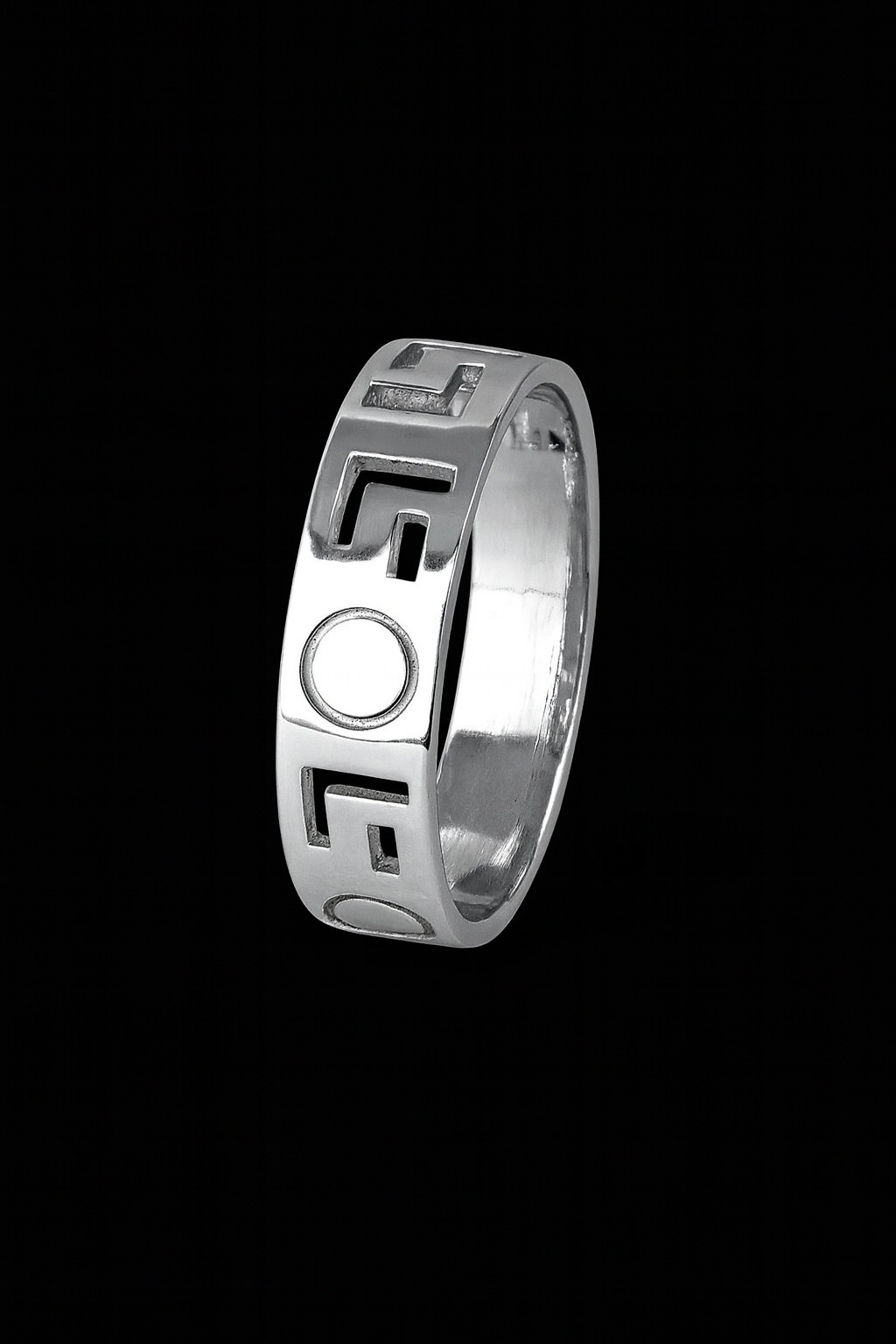 Silver ring with geometric design on a black background