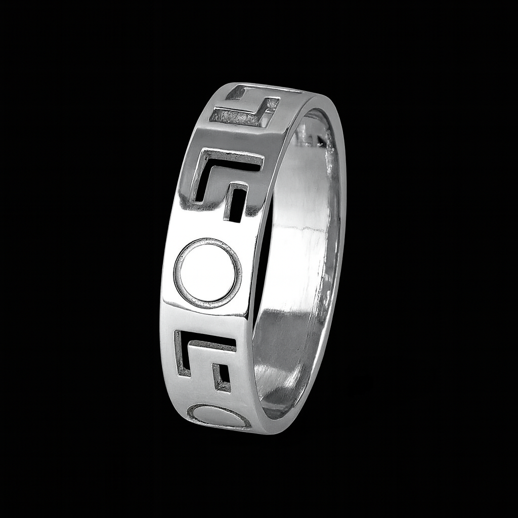 Silver ring with geometric design on a black background