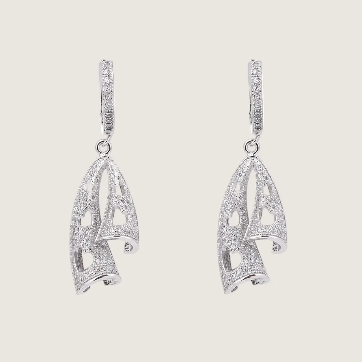 Silver elephant hoop earrings on a white background