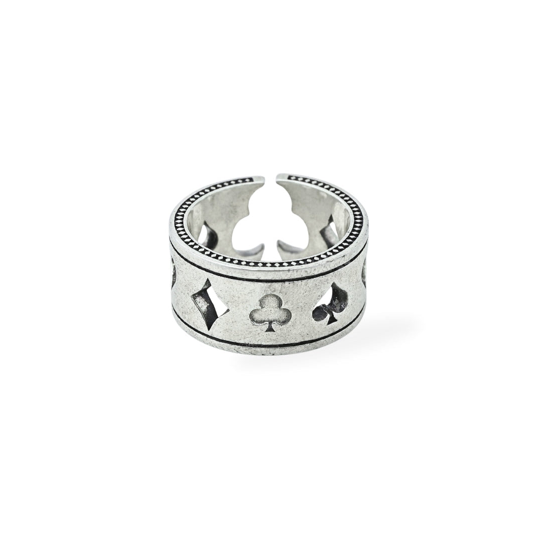 Silver ring with playing card suits on a white background, branded 'Trishnna'.