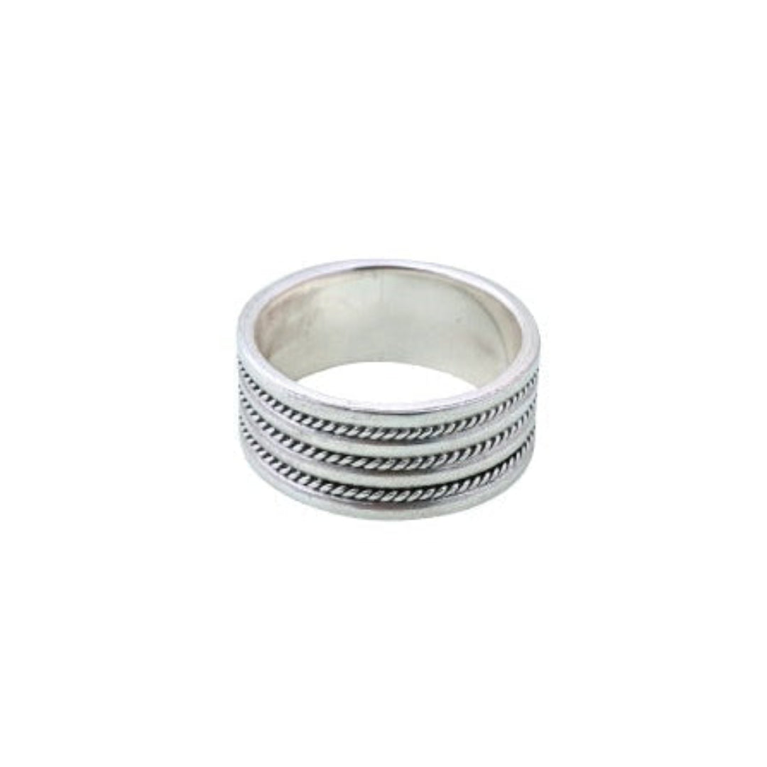 Stack of silver rings on a white background