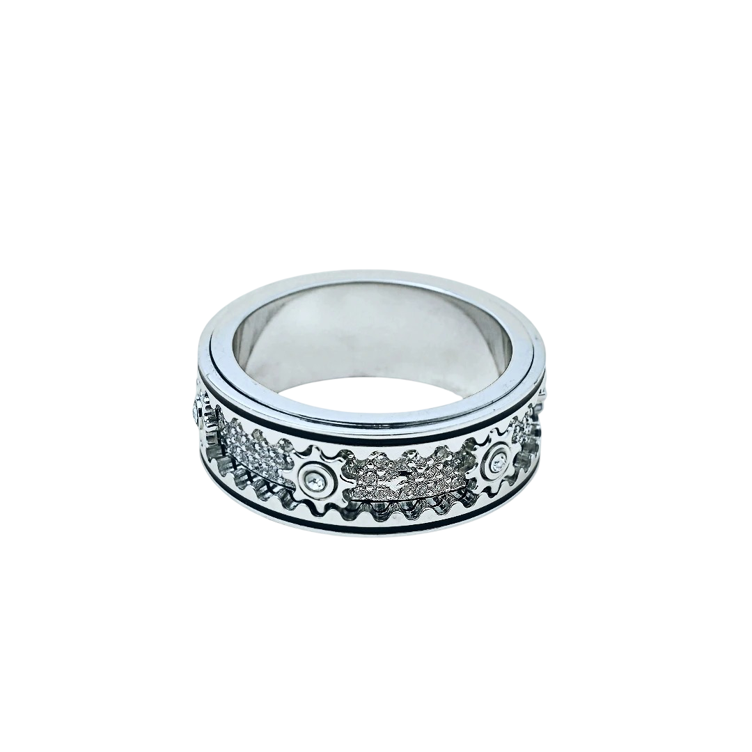Silver ring with decorative design on a white background